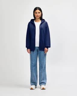 A navy blue Gildan Heavy Blend adult full zip hooded sweatshirt with a hood and a logo on the back.
