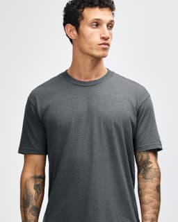 A grey unisex short sleeve t-shirt with a crew neckline and a branding logo.