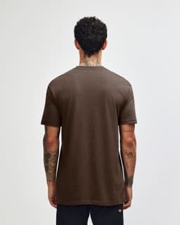 A unisex short sleeve T-shirt in brown, featuring a simple design and no visible logos on the back.