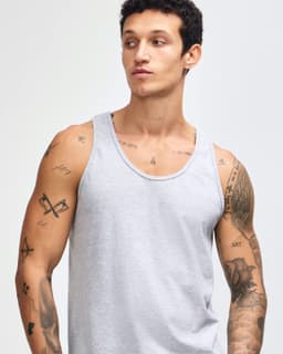 A light grey unisex fine jersey tank top featuring a classic design and a simple logo.