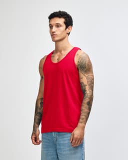 A red unisex fine jersey tank top is displayed on a model against a plain background. It has a logo on it.