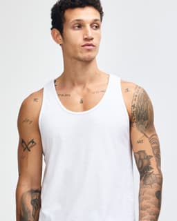 A unisex fine jersey tank top in white, featuring a simple design and no visible logos.