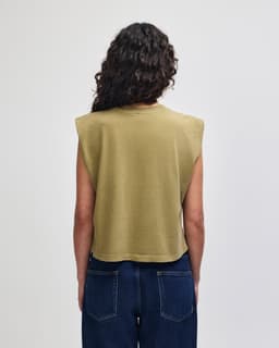 A green women's muscle t-shirt with a cropped design, featuring cap sleeves and a plain back view.