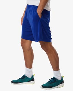 Men's performance shorts in bright blue, featuring pockets and an elastic waistband, paired with green and black trainers.