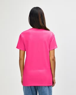 A back view of a pink Gildan Heavy Cotton Adult T-Shirt. The shirt features a logo on the upper back.