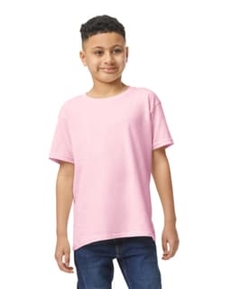 A youth t-shirt in light pink, featuring short sleeves and a relaxed fit, worn by a child. It has a logo visible.