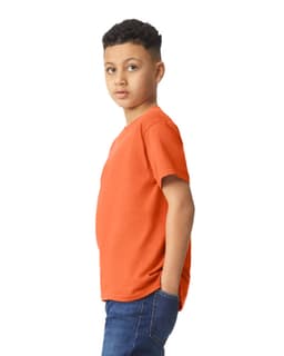 A youth t-shirt in orange, featuring a relaxed fit and a plain design without visible logos or text.