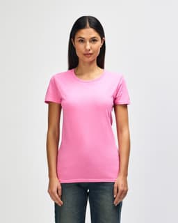 A pink Gildan Heavy Cotton Ladies' T-Shirt displayed on a model, featuring a round neck and short sleeves.