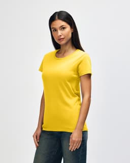 A yellow Gildan Heavy Cotton Ladies' T-Shirt displayed on a model, featuring a round neckline and short sleeves.