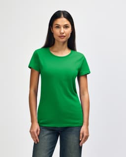 A green Gildan Heavy Cotton Ladies' T-Shirt displayed on a model wearing denim jeans. The shirt has a logo.