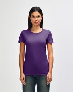 A purple Gildan Heavy Cotton Ladies' T-Shirt is displayed on a model, featuring short sleeves and a round neckline.