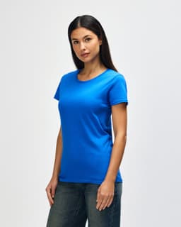 A blue Gildan Heavy Cotton Ladies' T-Shirt displayed on a model, featuring a classic crew neck and short sleeves.