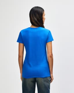 A blue Gildan Heavy Cotton ladies' T-shirt displayed from the back, featuring a simple design and short sleeves.