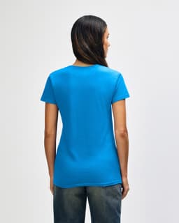 A blue Gildan Heavy Cotton Ladies' T-Shirt is displayed, featuring a simple design and a classic cut.