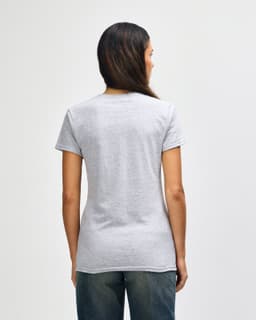 A women's grey Gildan Heavy Cotton T-shirt displayed from the back, featuring a simple design and short sleeves.