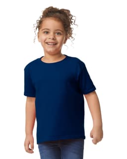 A toddler wearing a navy blue Gildan Heavy Cotton T-Shirt, smiling and standing with hands on hips.