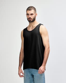 A black Gildan Heavy Cotton adult tank top with a relaxed fit, featuring a logo.