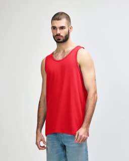 A red Gildan Heavy Cotton adult tank top displayed on a male model, featuring a simple design and a logo.