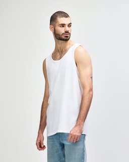 A white Gildan Heavy Cotton adult tank top displayed on a male model, with a simple logo present.