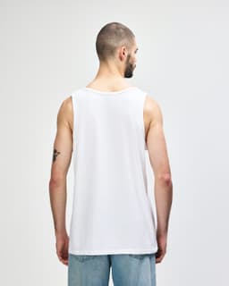 A white Gildan Heavy Cotton adult tank top, viewed from the back, featuring a plain design and a slightly loose fit.