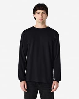A black long sleeve t-shirt featured on a model, showcasing a simple design and a brand logo.