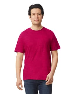 A man wearing a magenta Gildan Softstyle adult t-shirt, standing casually with a slight smile.
