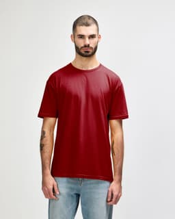 A red Gildan Softstyle adult T-shirt is displayed on a model, featuring a simple design and a branding logo.