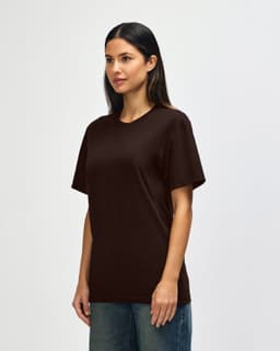 A brown Gildan Softstyle adult t-shirt displayed on a model, with a casual fit and no visible logos.