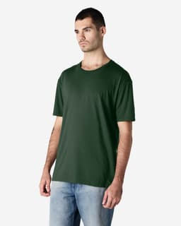 A dark green Gildan Softstyle adult t-shirt on a male model, paired with light blue jeans, featuring a logo.