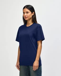 A navy blue Gildan Softstyle adult t-shirt displayed on a model, featuring a simple design and a logo.