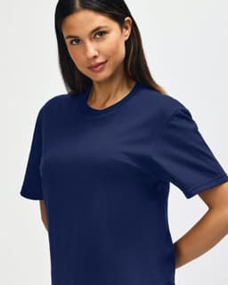 A navy Gildan Softstyle adult T-shirt on a male model, featuring a crew neck and relaxed fit.