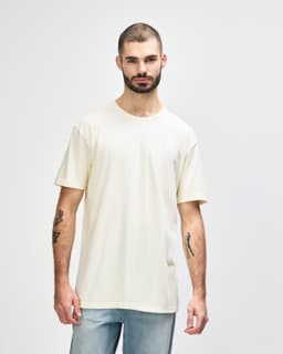 A white Gildan Softstyle adult t-shirt displayed on a male model, featuring a simple design and relaxed fit.