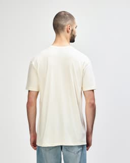 A white Gildan Softstyle adult T-shirt viewed from the back, featuring a simple design and fitted style.