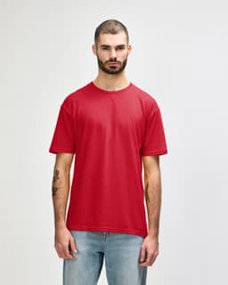 A red Gildan Softstyle adult T-shirt displayed on a model, featuring a relaxed fit and short sleeves.