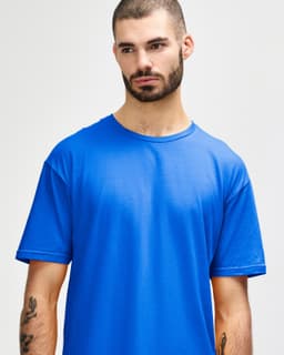 A blue Gildan Softstyle adult t-shirt with a crew neck, featuring a branding logo.