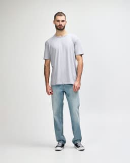 A grey Gildan Softstyle adult t-shirt with a straight back design, displayed on a model.