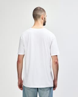 A white Gildan Softstyle adult t-shirt displayed from the back, with a plain design and no visible branding.