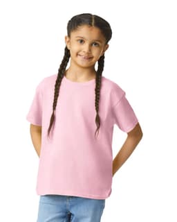 A youth softstyle short sleeve t-shirt in pink, worn by a girl with braided hair, smiling at the camera.
