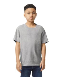 A grey Gildan Youth Softstyle short sleeve T-shirt displayed on a model standing with hands at sides.