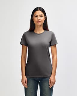 A grey Gildan Softstyle ladies' T-shirt displayed on a model, featuring a classic round neckline and short sleeves.