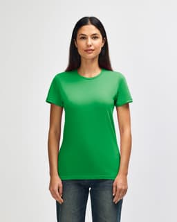 A green Gildan Softstyle ladies' T-shirt displayed on a model, featuring a classic crew neck and short sleeves.