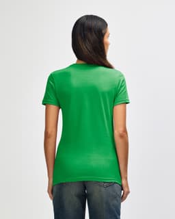 A green Gildan Softstyle ladies' T-shirt is displayed from the back, featuring a fitted design.