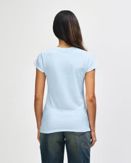 A light blue Gildan Softstyle ladies' t-shirt is displayed from the back, featuring a standard fit and short sleeves.