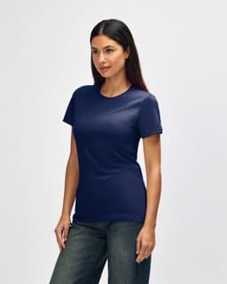 A navy blue Gildan Softstyle ladies' T-shirt displayed on a model, featuring a simple design and short sleeves.