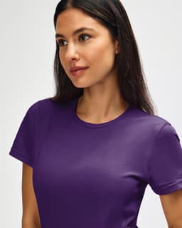 A purple Gildan Softstyle ladies' T-shirt displayed on a model with a neutral background.