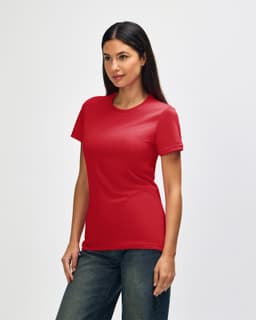 A red Gildan Softstyle ladies' T-shirt displayed on a model, featuring short sleeves and a fitted style.