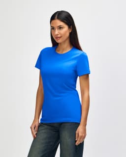 A blue Gildan Softstyle Ladies' T-Shirt displayed on a model, featuring a simple design and short sleeves.