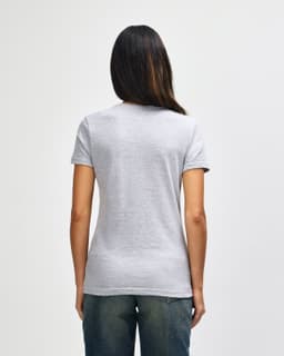 A grey ladies' t-shirt with short sleeves, featuring a design on the back and a fitted shape.