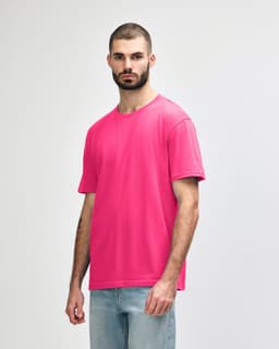 A midweight adult T-shirt in bright pink, featuring a crew neckline and short sleeves. It has a logo on the front.