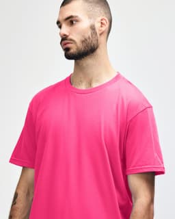 A midweight adult T-shirt in vibrant pink, featuring a round neck and short sleeves, with a logo visible.